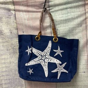 Brand new with out tags Woman’s Mud Pie Tote bag.